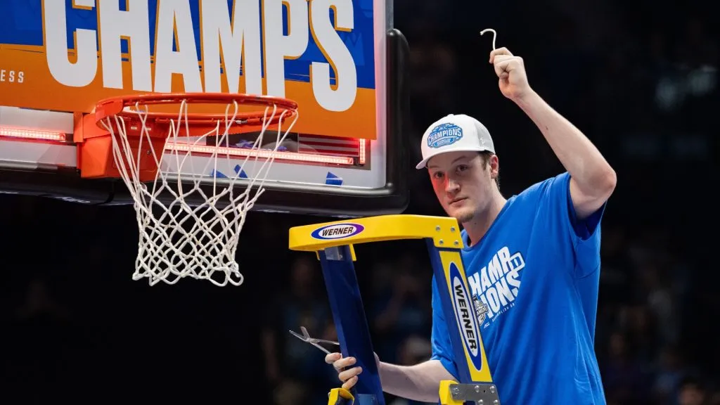 Kon Knueppel #7 of the Duke Blue Devils cuts down the net after defeating the Louisville Cardinals during the championship round of the ACC men’s basketball tournament in 2025. (Source: Jacob Kupferman/Getty Images)