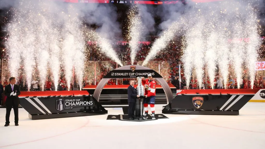 NHL commissioner Gary Bettman presents Aleksander Barkov #16 of the Florida Panthers with the Stanley Cup after the Florida Panthers defeated the Edmonton Oilers 5-1 in Game Six of the 2025 Stanley Cup Final at Amerant Bank Arena on June 17, 2025 in Sunrise, Florida. (Photo by Bruce Bennett/Getty Images)