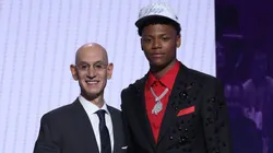 Ace Bailey (R) shakes hands with NBA commissioner Adam Silver (L) after being drafted fifth overall by the Utah Jazz during the first round of the 2025 NBA Draft at Barclays Center on June 25, 2025.