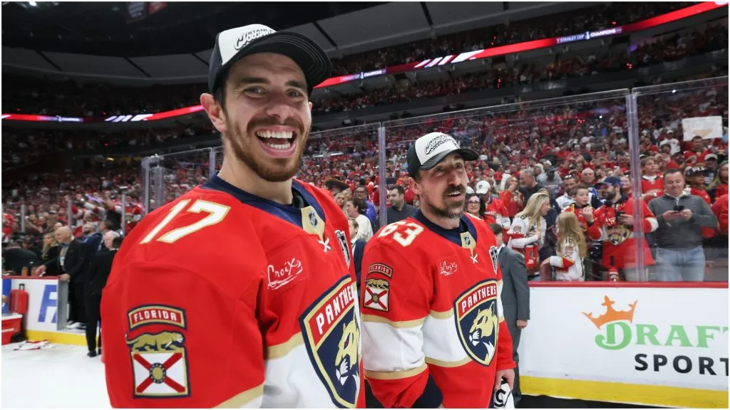 Evan Rodrigues #17 and Brad Marchand #63 of the Florida Panthers celebrate after defeating the Edmonton Oilers in Game Six of the 2025 Stanley Cup Final at Amerant Bank Arena on June 17, 2025 in Sunrise, Florida.