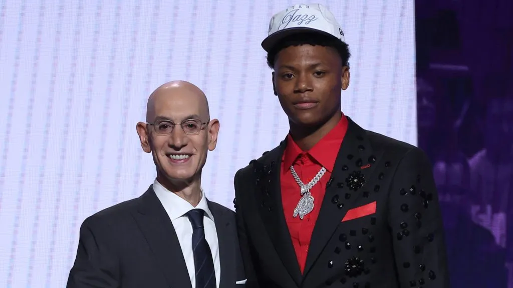 Ace Bailey (R) shakes hands with NBA commissioner Adam Silver (L) after being drafted fifth overall by the Utah Jazz during the first round of the 2025 NBA Draft. (Source: Sarah Stier/Getty Images)
