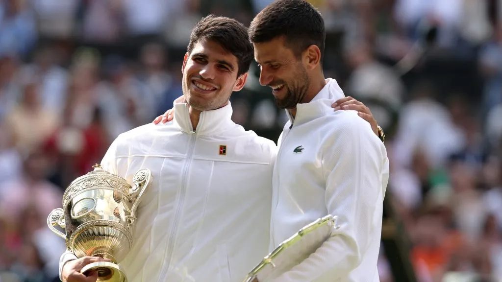 Carlos Alcaraz of Spain with the trophy alongside runner up Novak Djokovic of Serbia after the Wimbledon final. (Julian Finney/Getty Images)