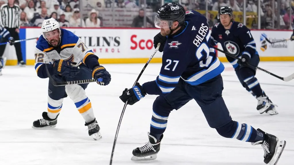 Nikolaj Ehlers #27 of the Winnipeg Jets attempts a shot as Justin Faulk #72 of the St. Louis Blues defends during the second period in Game Seven of the First Round of the 2025 Stanley Cup Playoffs at Canada Life Centre on May 04, 2025 in Winnipeg, Manitoba, Canada. (Photo by Cameron Bartlett/Getty Images)