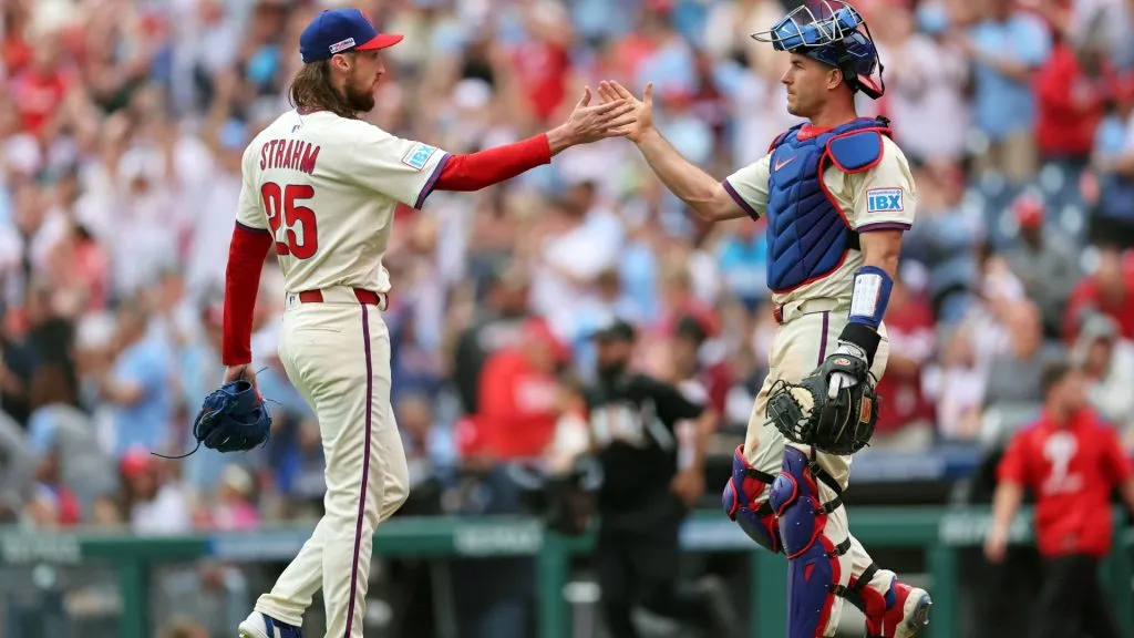 (L-R) Matt Strahm #25 and J.T. Realmuto #10 of the Philadelphia Phillies celebrate after winning a game against the Toronto Blue Jays at Citizens Bank Park on June 14, 2025 in Philadelphia, Pennsylvania. (Photo by Hunter Martin/Getty Images)