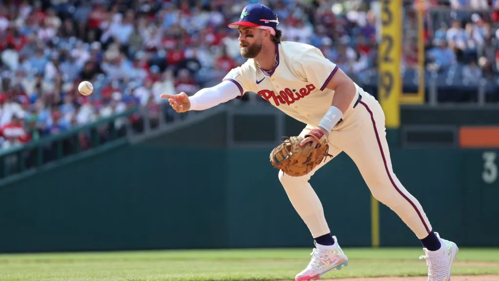 Bryce Harper #3 of the Philadelphia Phillies tosses the ball to first base after fielding a ground ball in the ninth inning during a game against the Miami Marlins at Citizens Bank Park on April 20, 2025 in Philadelphia, Pennsylvania. (Photo by Hunter Martin/Getty Images)