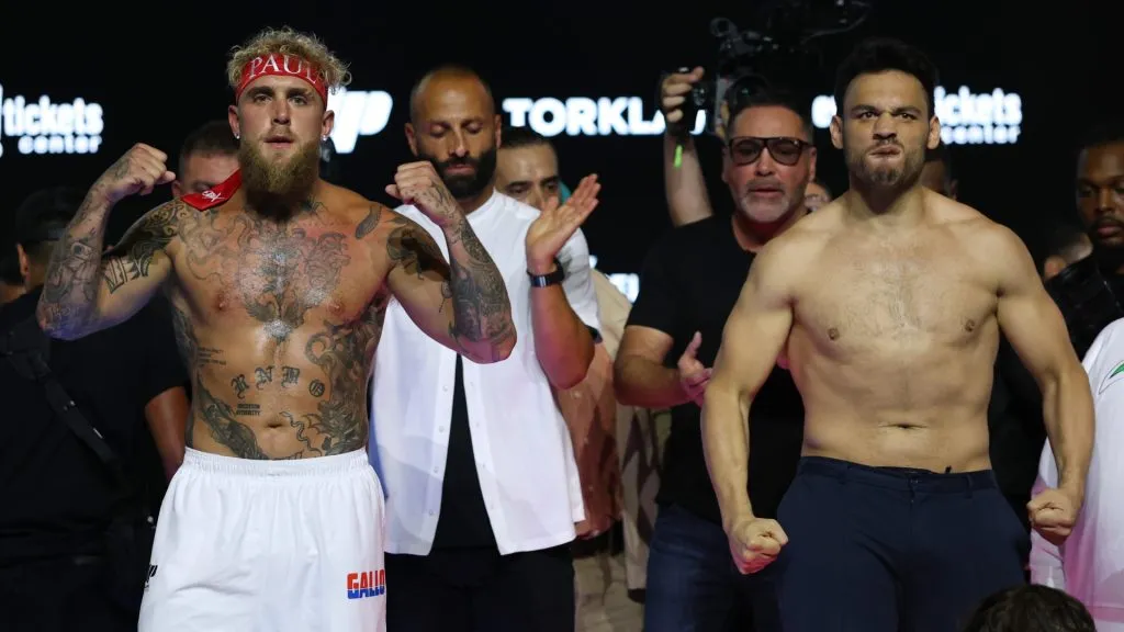 Jake Paul and Julio Cesar Chavez Jr. react during a ceremonial weigh-in before their fight at Honda Center on June 27, 2025 in Anaheim, California. (Photo by Harry How/Getty Images)
