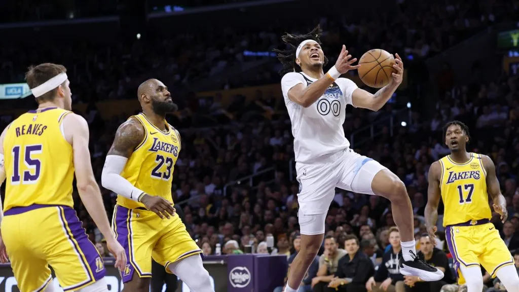 Terrence Shannon Jr. #00 of the Minnesota Timberwolves scores on a layup in front of Austin Reaves #15, LeBron James #23 and Dorian Finney-Smith #17 of the Los Angeles Lakers
