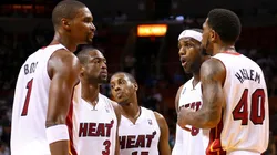 LeBron James #6 of the Miami Heat talks with Dwyane Wade #3, Chris Bosh #1, Mario Chalmers #15 and Udonis Haslem #40 during a game against the Golden State Warriors at American Airlines Arena on December 12, 2012 in Miami, Florida.