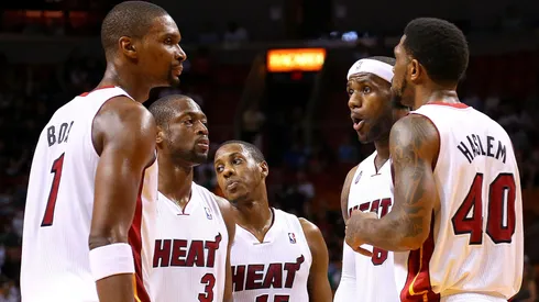 LeBron James #6 of the Miami Heat talks with Dwyane Wade #3, Chris Bosh #1, Mario Chalmers #15 and Udonis Haslem #40 during a game against the Golden State Warriors at American Airlines Arena on December 12, 2012 in Miami, Florida.