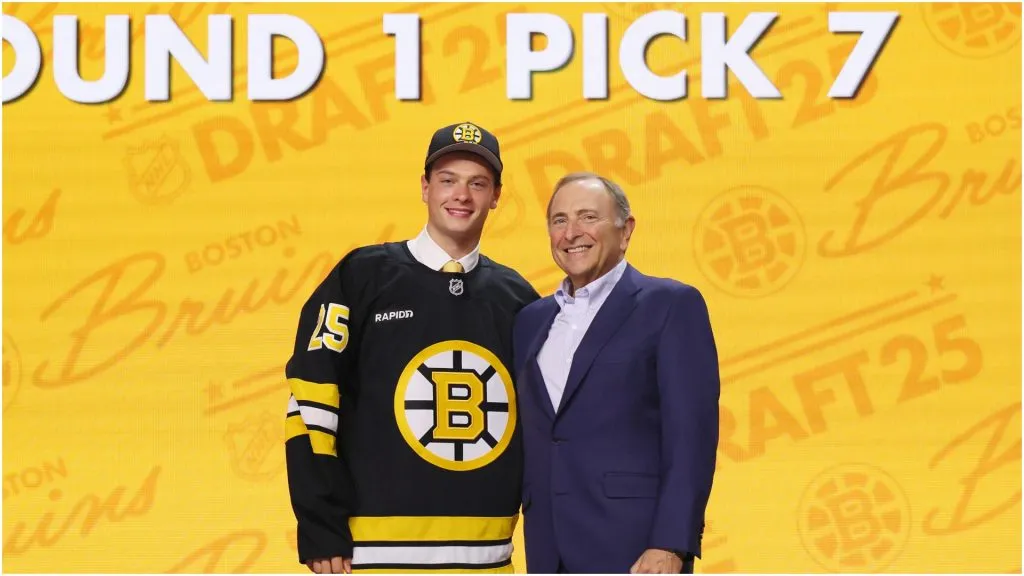 James Hagens poses with NHL commissioner Gary Bettman after being drafted by the Boston Bruins with the number seven overall pick during the first round of the 2025 Upper Deck NHL Draft at the Peacock Theater on June 27, 2025 in Los Angeles, California.