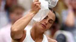 Aryna Sabalenka places an ice pack on her head during a break between sets at Wimbledon 2023