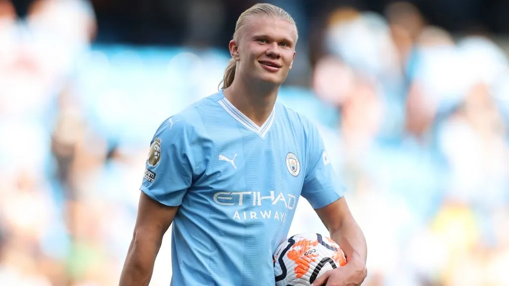 Erling Haaland of Manchester City carries the matchball after scoring a hat-trick during the Premier League match between Manchester City and Fulham FC in 2023. (Source: Lewis Storey/Getty Images)