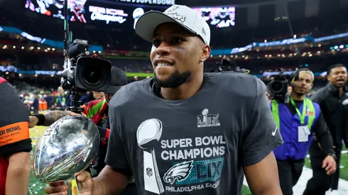 Saquon Barkley #26 of the Philadelphia Eagles celebrates with the Vince Lombardi Trophy after beating the Kansas City Chiefs 40-22 to win Super Bowl LIX at Caesars Superdome on February 09, 2025 in New Orleans, Louisiana.