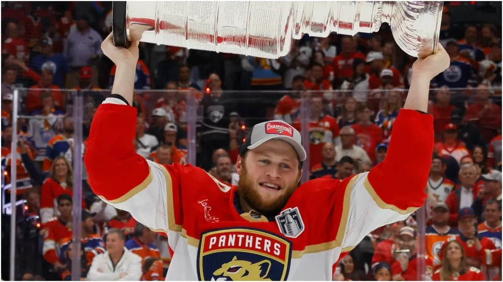 Steven Lorentz #18 of the Florida Panthers hoists the cup after Florida's 2-1 victory against the Edmonton Oilers in Game Seven of the 2024 Stanley Cup Final at Amerant Bank Arena on June 24, 2024 in Sunrise, Florida.