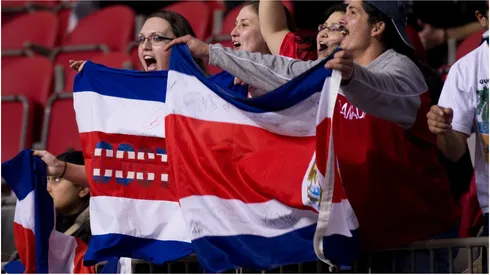 Costa Rican fans hold their contry's flag
