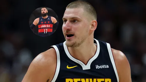Nikola Jokic #15 of the Denver Nuggets and Jonas Valanciunas