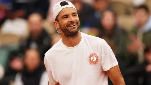 Grigor Dimitrov of Bulgaria reacts while he is practising with Jannik Sinner of Italy at Roland Garros on May 24, 2025.
