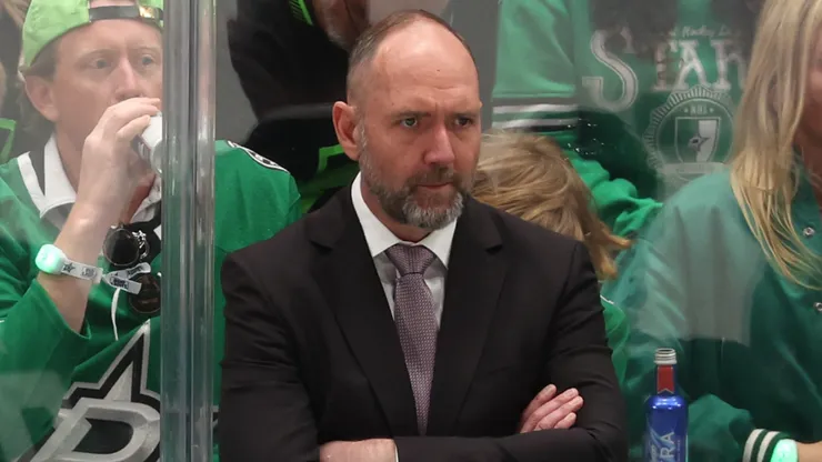 Former Dallas Stars head coach Peter DeBoer looks on from behind the bench during a 2024 NHL game, prior to being relieved of his duties after two seasons with the team.