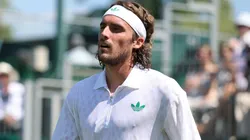 Stefanos Tsitsipas of Greece reacts as he retires against Valentin Royer of France during Wimbledon.