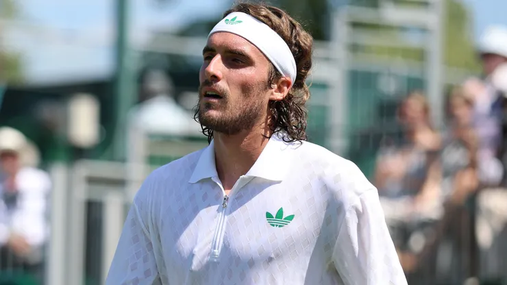 Stefanos Tsitsipas of Greece reacts as he retires against Valentin Royer of France during Wimbledon.
