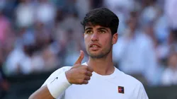 Carlos Alcaraz gestures during 2025 Wimbledon first round match