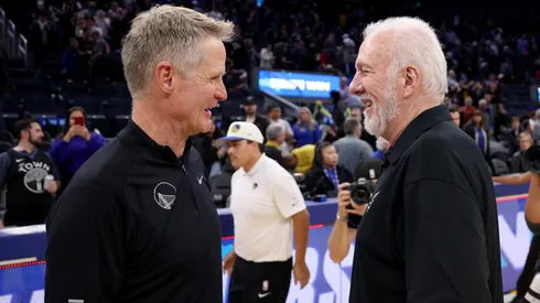 Golden State Warriors head coach Steve Kerr talks with San Antonio Spurs head coach Gregg Popovich (right) after their teams played at Chase Center.