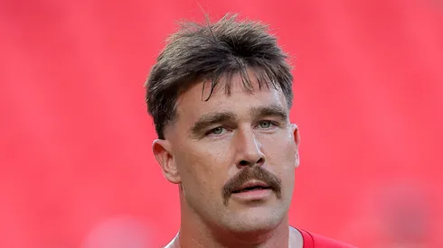 Travis Kelce looks on during warmups.