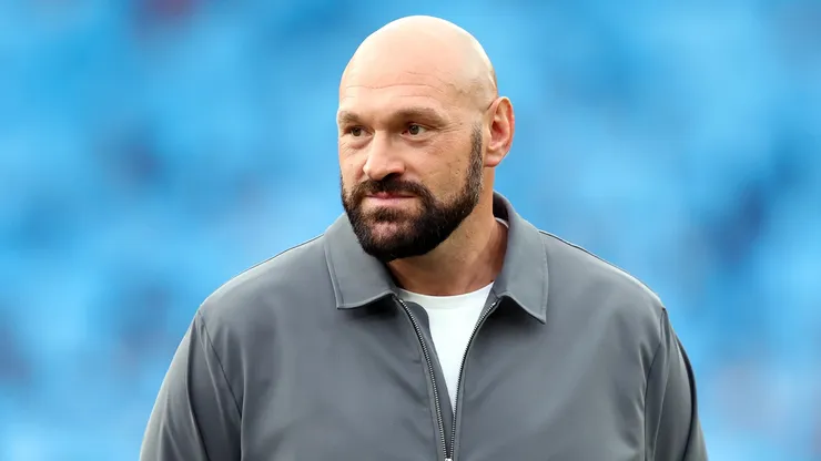 Tyson Fury speaks to reporters during a media scrum.