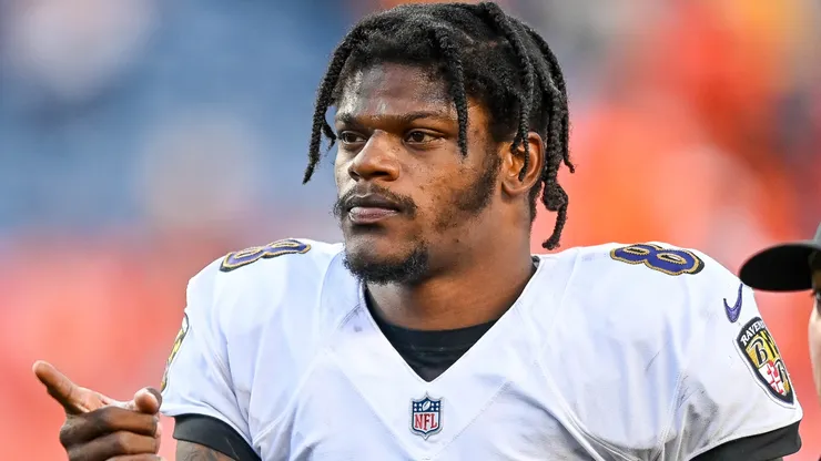 Lamar Jackson walks off the field after a win over the Broncos on October 3, 2021 in Denver.