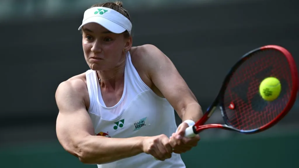 Elena Rybakina of Kazakhstan plays a backhand against Maria Sakkari of Greece during the Ladies’ Singles second round match on day four of The Championships Wimbledon 2025. (Source: Hannah Peters/Getty Images)