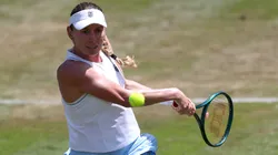 Ekaterina Alexandrova plays a backhand as she competes against Iga Swiatek of Poland during their Quarter Final match on Day Five of the Bad Homburg Open in 2025.