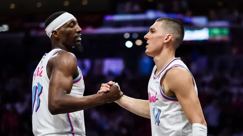 Bam Adebayo (L) #13 of the Miami Heat and Tyler Herro #14 of the Miami Heat reacts during the fourth quarter against the Atlanta Hawks at Kaseya Center on March 27, 2025 in Miami, Florida. NOTE TO USER: User expressly acknowledges and agrees that, by downloading and or using this photograph, User is consenting to the terms and conditions of the Getty Images License Agreement.