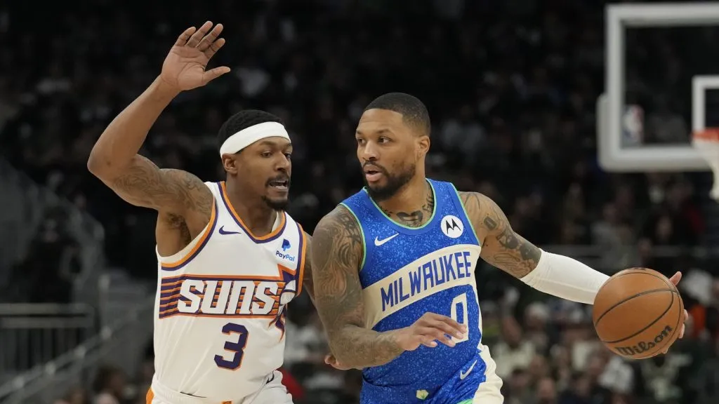 MILWAUKEE, WISCONSIN – MARCH 17: Damian Lillard #0 of the Milwaukee Bucks dribbles the ball against Bradley Beal #3 of the Phoenix Suns during the first half at Fiserv Forum on March 17, 2024 in Milwaukee, Wisconsin. (Photo by Patrick McDermott/Getty Images)