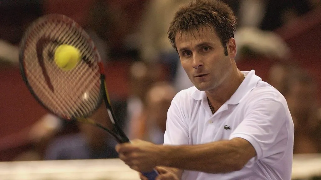 Fabrice Santoro of France plays a forehand during his straight sets quarter final victory over Roger Federer of Switzerland during the Tennis Masters Madrid. (Clive Brunskill/Getty Images)