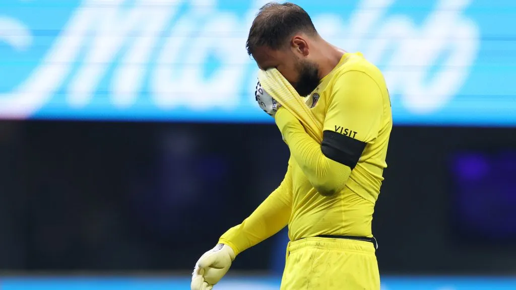 Gianluigi Donnarumma #1 of Paris Saint-Germain reacts after colliding with Jamal Musiala #42 of FC Bayern Munchen. (Kevin C. Cox/Getty Images)