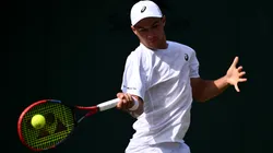Kamil Majchrzak plays a forehand against Arthur Rinderknech during the third round match of The Championships Wimbledon 2025