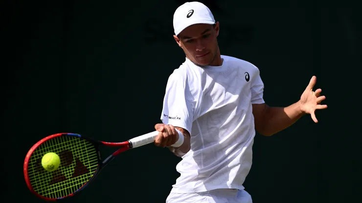 Kamil Majchrzak plays a forehand against Arthur Rinderknech during the third round match of The Championships Wimbledon 2025