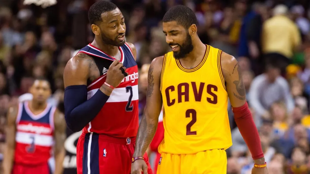 John Wall #2 of the Washington Wizards talks with Kyrie Irving #2 of the Cleveland Cavaliers on March 25, 2017