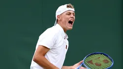 Cruz Hewitt celebrates a break point against Savva Rybkin during the Boy's Singles first round match