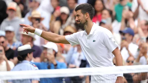 Novak Djokovic of Serbia points towards the Royal Box after winning match point against Alex De Minaur of Australia during the Gentlemen's Singles fourth round match on day eight of The Championships Wimbledon 2025.