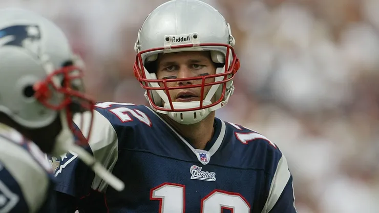 Quarterback Tom Brady #12 of the New England Patriots celebrates on the field during the game against the Arizona Cardinals at Sun Devil Stadium on September 19, 2004 in Tempe, Arizona.