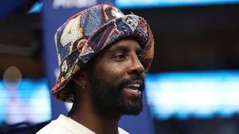 Dallas Mavericks player Kyrie Irving watches action during a game between the Dallas Wings and the Indiana Fever at American Airlines Center on June 27, 2025 in Dallas, Texas.