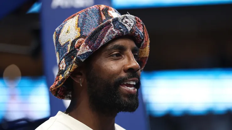 Dallas Mavericks player Kyrie Irving watches action during a game between the Dallas Wings and the Indiana Fever at American Airlines Center on June 27, 2025 in Dallas, Texas.