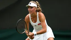 Magdalena Frech of Poland looks on against Ons Jabeur of Tunisia in the Women's Singles first round match during day two of The Championships Wimbledon 2023.