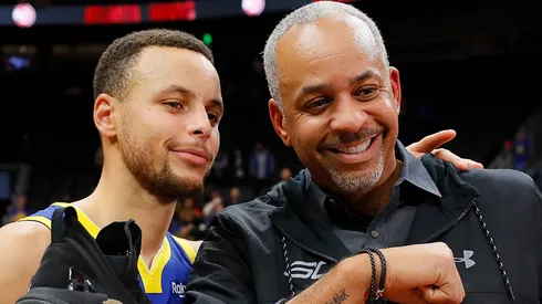Stephen Curry #30 of the Golden State Warriors poses with his dad Dell Curry