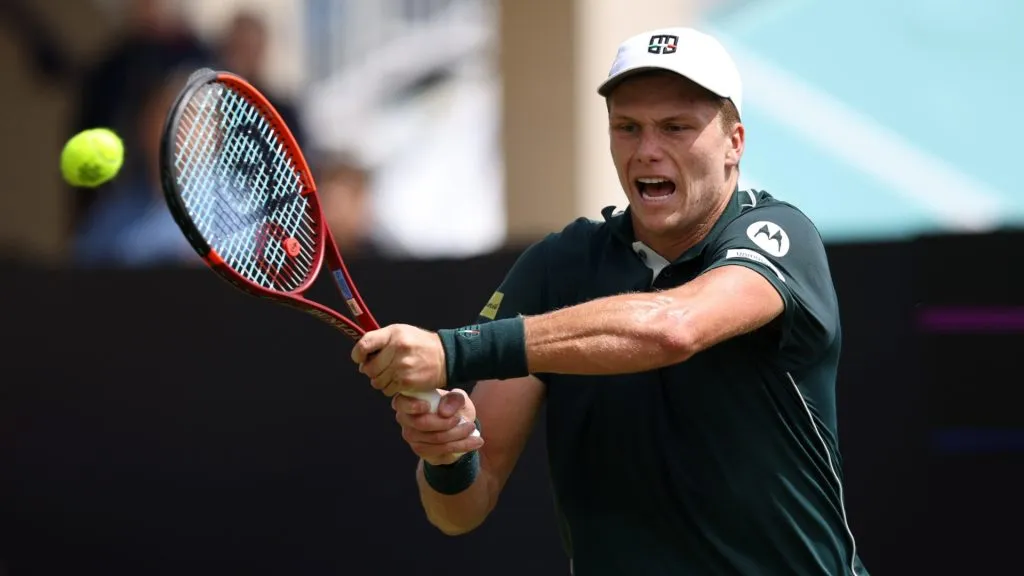 Jenson Brooksby of United States plays a backhand against Dan Evans of Great Britain during the Men’s Singles Quarter Final match on Day Four of the Lexus Eastbourne Open. (Source: Charlie Crowhurst/Getty Images for LTA)