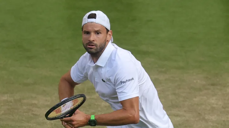 Grigor Dimitrov of Bulgaria plays a backhand against Jannik Sinner of Italy during the Gentlemen's Singles fourth round match on day eight of The Championships Wimbledon 2025 at All England Lawn Tennis and Croquet Club on July 07, 2025 in London, England.