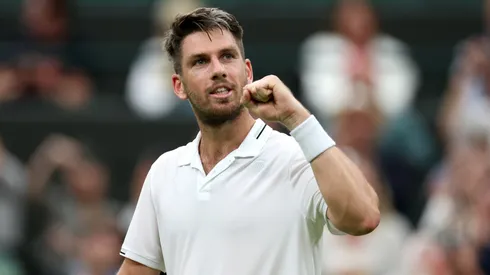 Cameron Norrie of Great Britain celebrates winning match point against Tomas Machac of Czech Republic in the Men's Singles first round match during day two of The Championships Wimbledon 2023.