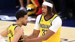 Myles Turner #33 of the Indiana Pacers talks with Tyrese Haliburton #0 during the third quarter against the New York Knicks in Game Three of the Eastern Conference Finals of the 2025 NBA Playoffs