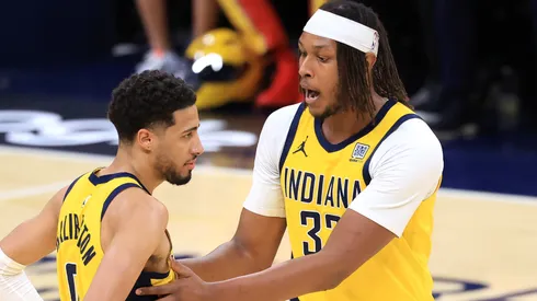 Myles Turner #33 of the Indiana Pacers talks with Tyrese Haliburton #0 during the third quarter against the New York Knicks in Game Three of the Eastern Conference Finals of the 2025 NBA Playoffs